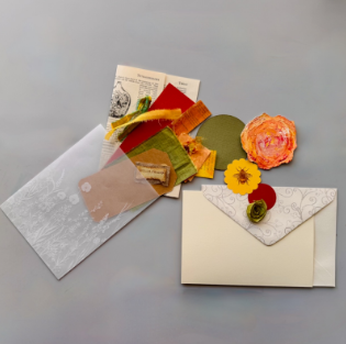 Pockets Full of Posies envelope sealed with a paper flower