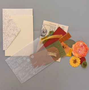 Pockets Full of Posies supplies with specialty papers, ribbon and paper flowers
